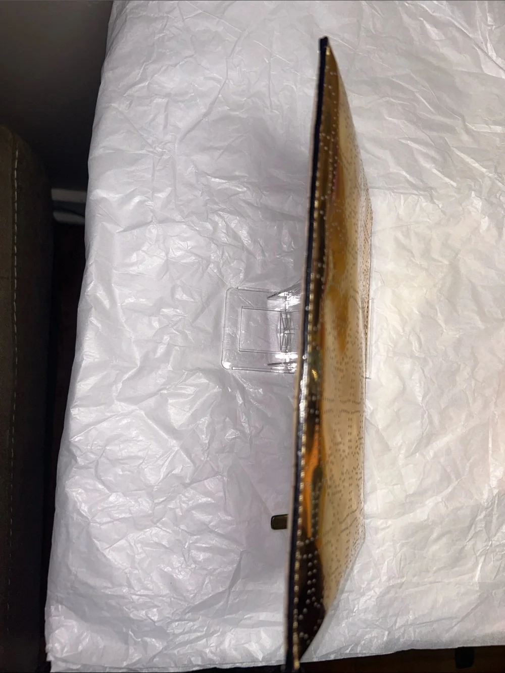 Kate Spade New York metallic gold pouch featuring a perforated spade pattern EUC